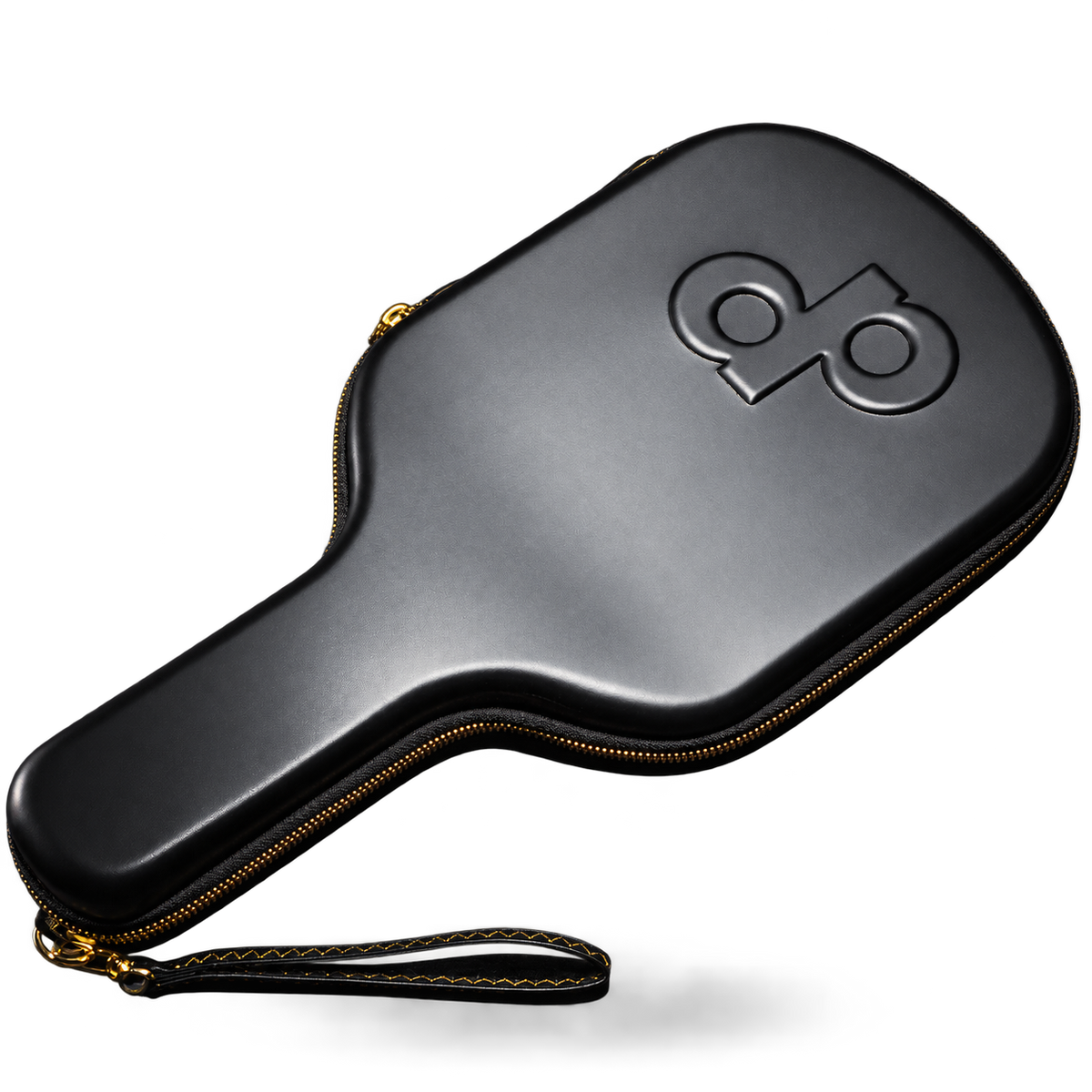 Black paddle-shaped High Roller travel case with a debossed DP logo, gold zipper and stitched wrist strap.