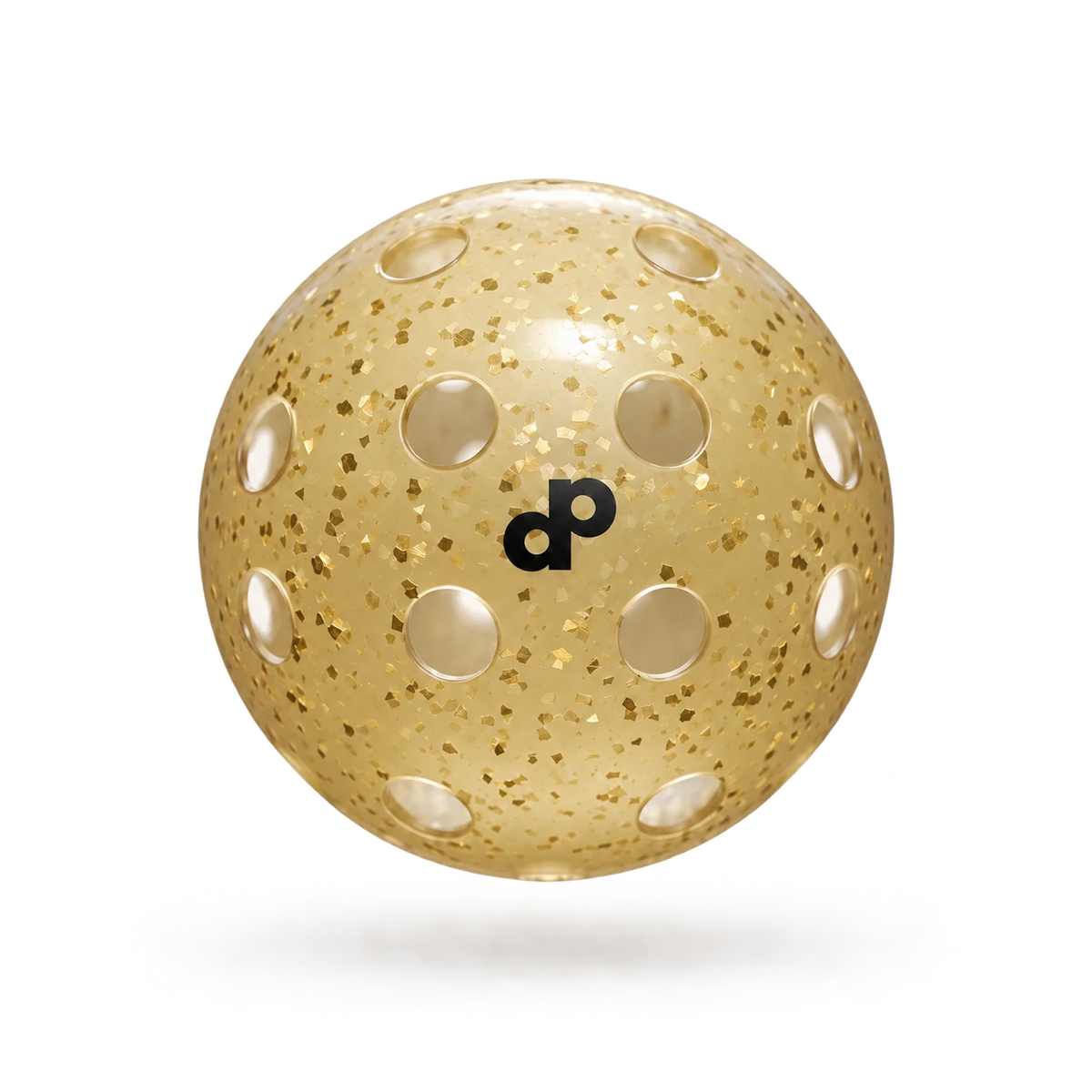 Single DOPE High Roller gold glitter pickleball with black DP logo, circular holes and gold foil flakes, floating on cream.