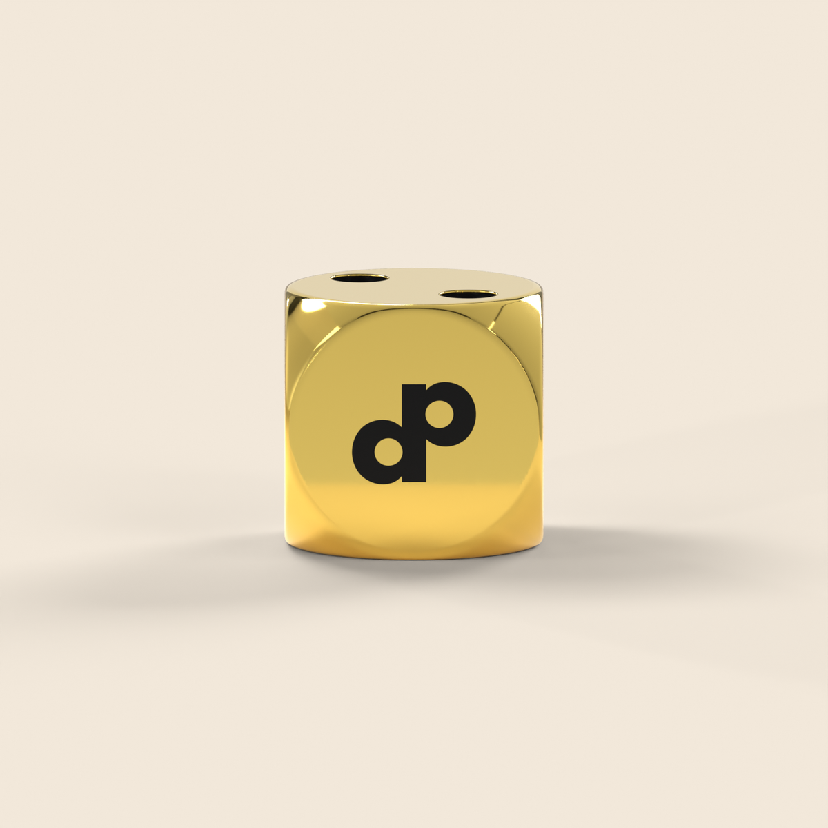 High Roller gold metal die viewed from the front, with its black DP mark and a soft contact shadow on cream.