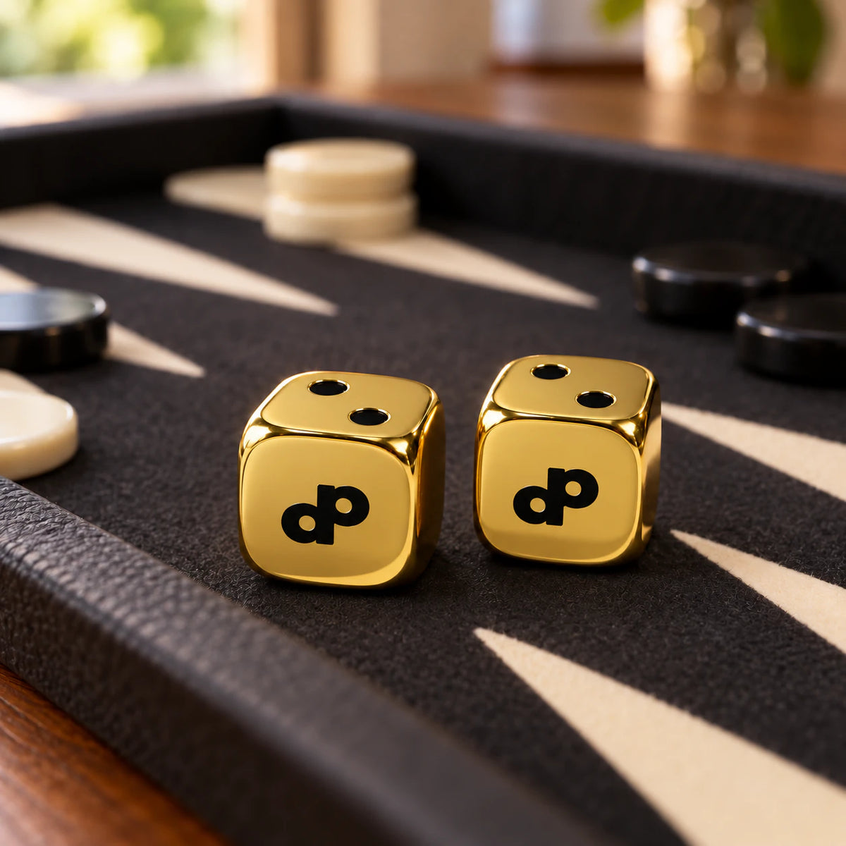 Smooth gold High Roller dice on a backgammon board; board and counters are styling props.
