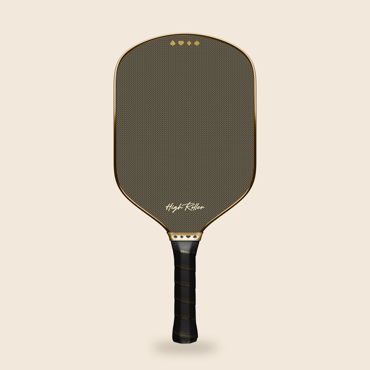 Full straight front view of the High Roller paddle with its gold patterned face, metallic gold outline, suit-symbol collar and printed black grip, floating on cream.