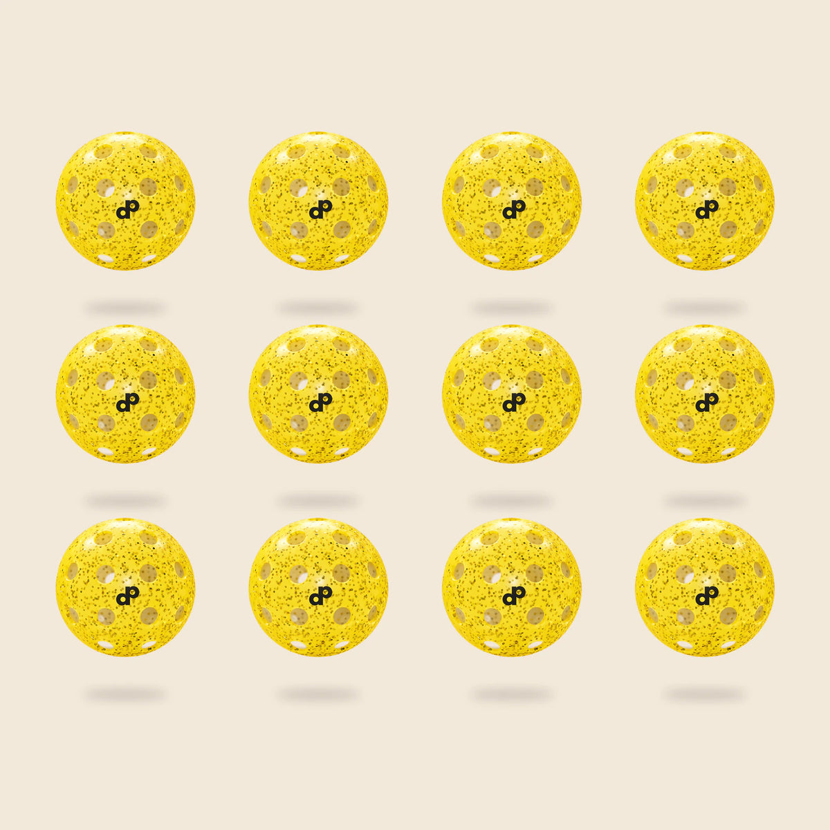 12 yellow DOPE glitter pickleballs, each with its black DP logo and original circular-hole layout, floating on cream.