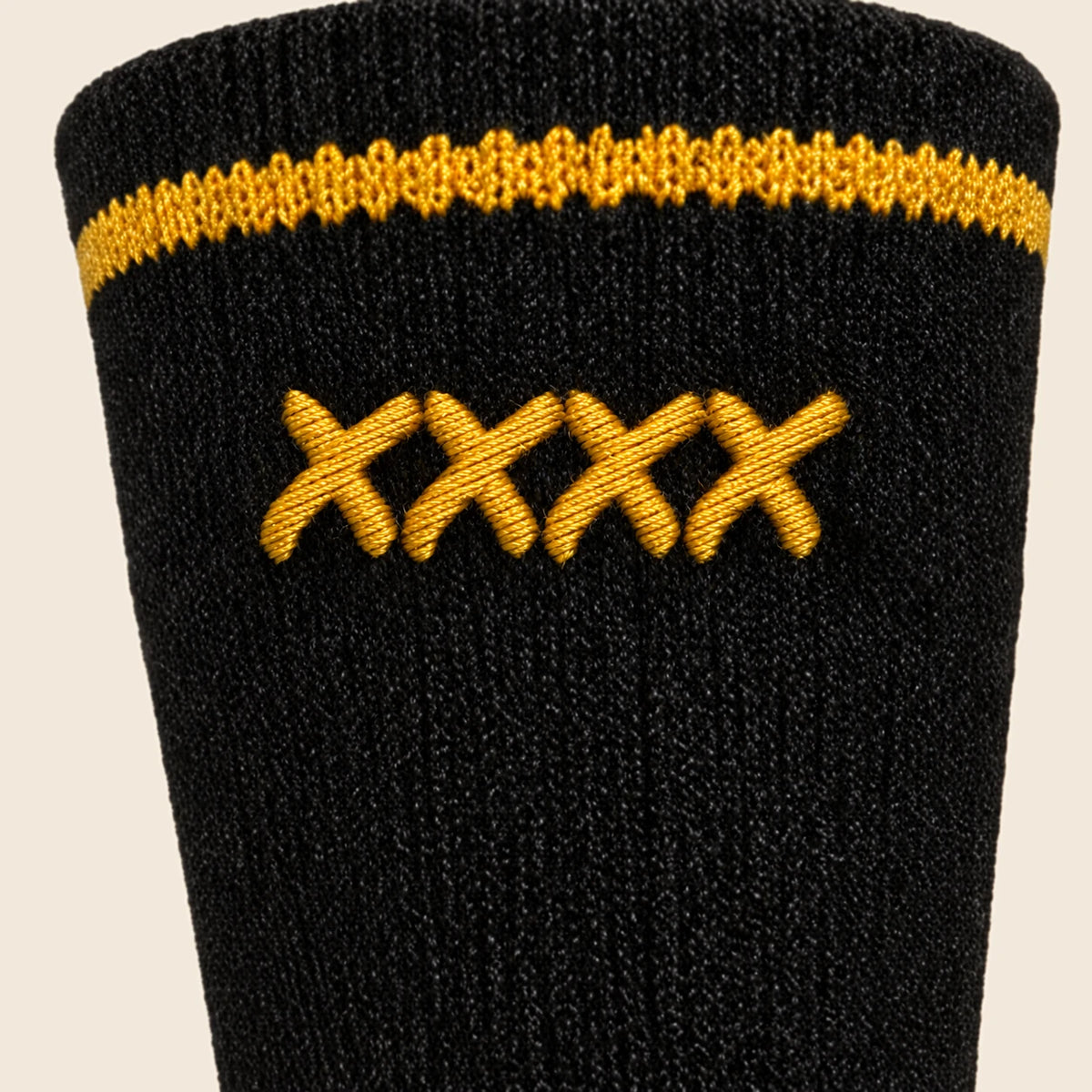 Close detail of four gold Permanent Marker-style x stitches in one line on the rear High Roller sock cuff.