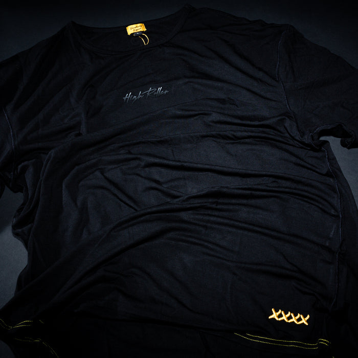 Black High Roller Lounge T-shirt arranged in a dark flat lay