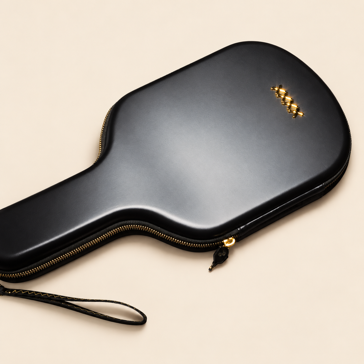 Rear detail of the High Roller paddle case with four gold X marks, gold zipper and stitched wrist loop on a cream background.