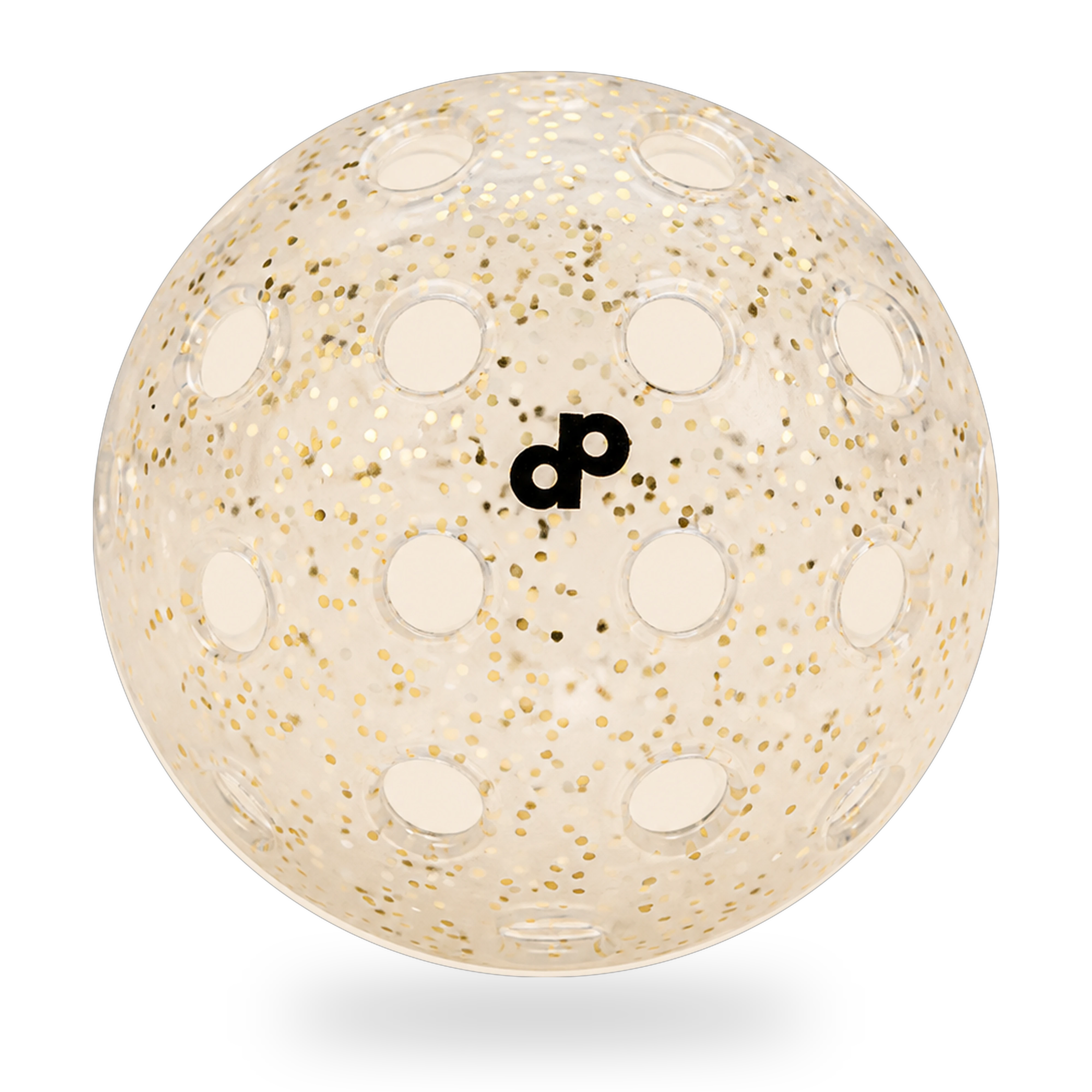 DOPE clear pickleball with suspended metallic gold glitter and black monogram, floating above a soft shadow on the brand beige background