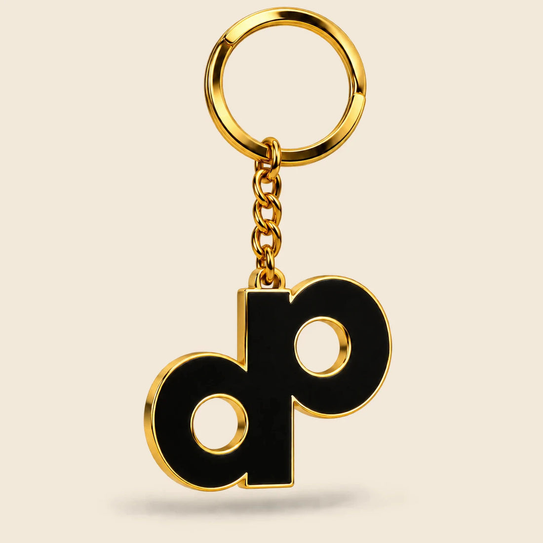 High Roller DP logo keychain with black enamel, gold-tone metal edges, short chain and split ring.