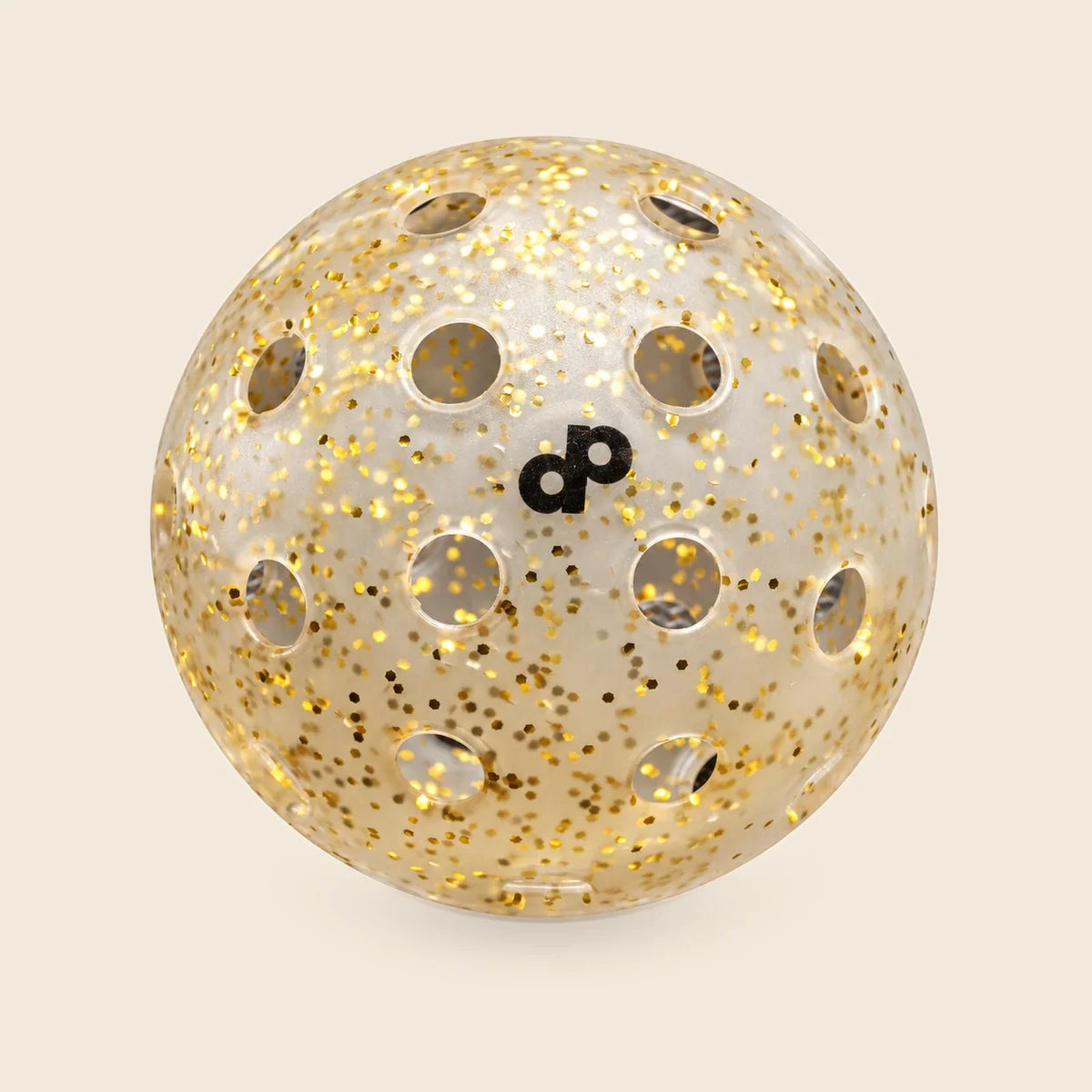 One translucent High Roller gold-glitter pickleball with black DP print and circular openings.