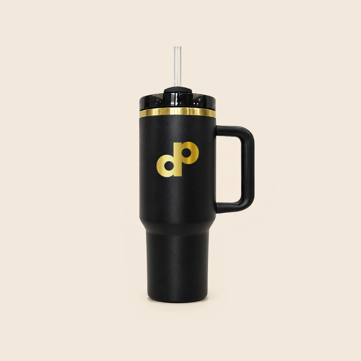 Complete front view of the High Roller 40 oz tumbler, with clear straw, gold DP logo, black handle and full base on cream.