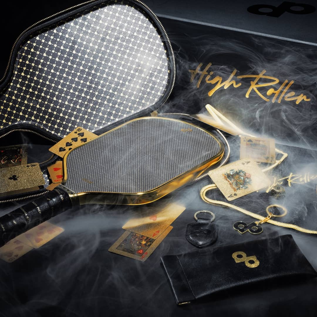 A closeup photo highlighting some of the key contents included in Dope Pickleball Co's High Roller Club Bundle.