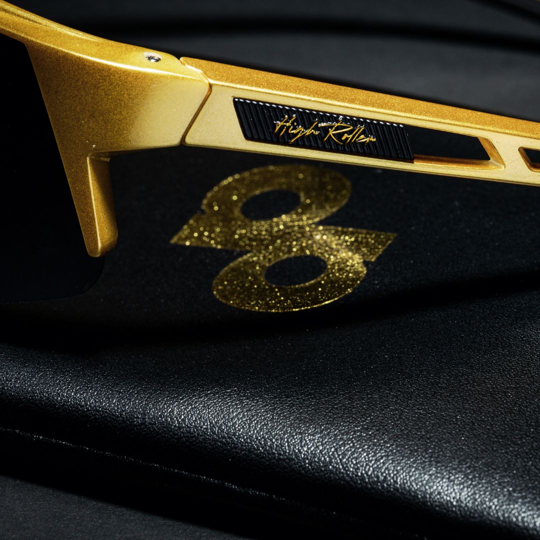 A view of the Left Temple side of the High Roller Sunglasses, showcasing the "High Roller" script.