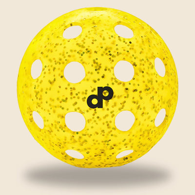 Yellow glitter-infused outdoor pickleball ball by Dope Pickleball Co.