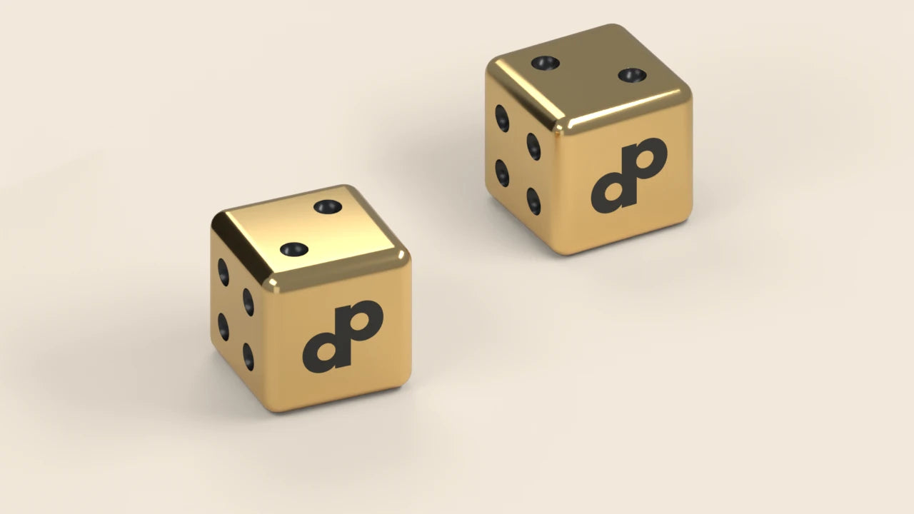 Two rounded gold dice with dark pips and DOPE DP marks